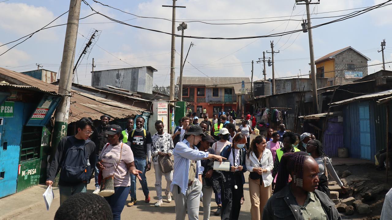 a group of people touring a city in Kenya